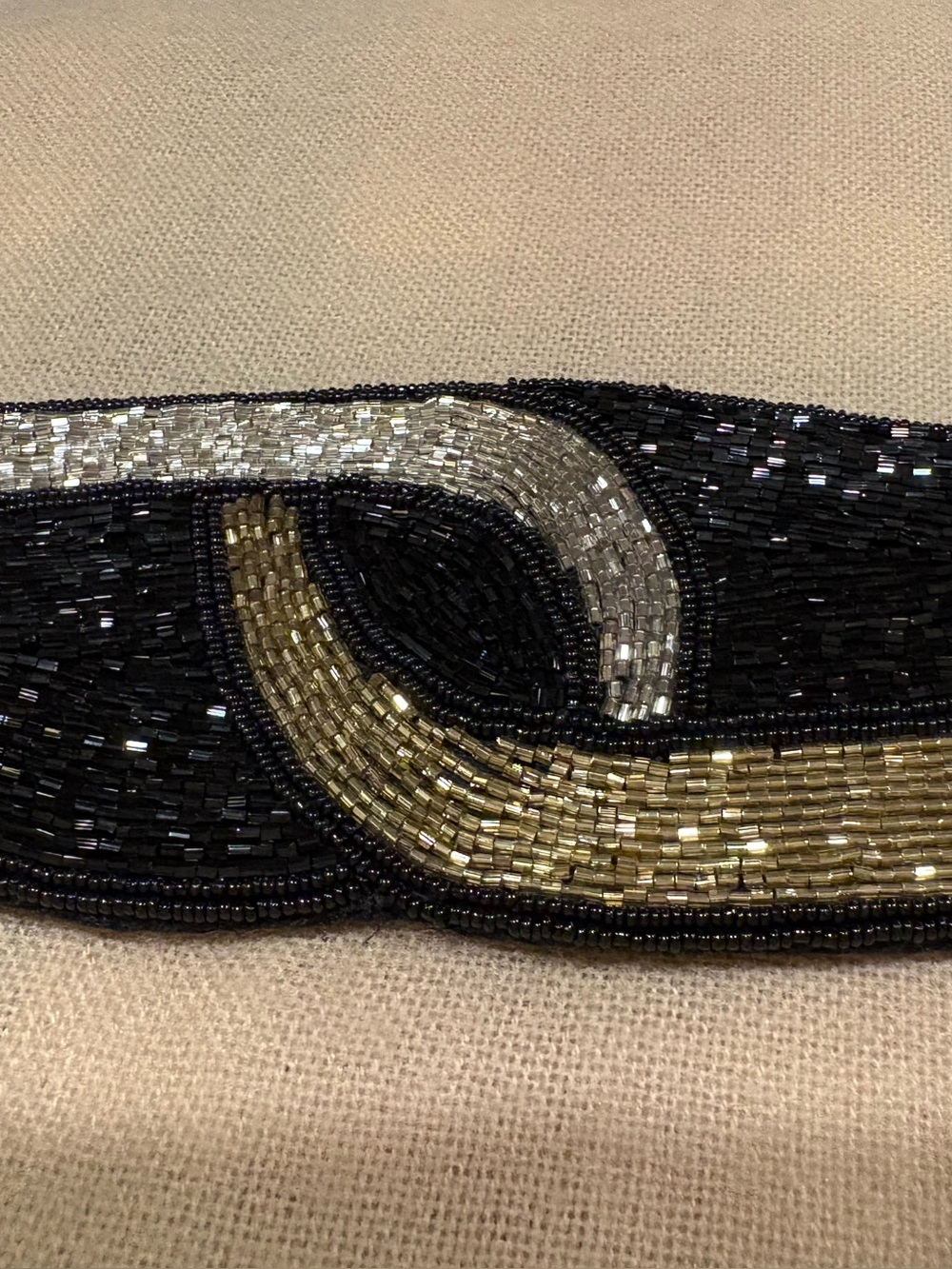 Black beaded belt with and metallic gold beadwork in a swirling design, size M/L